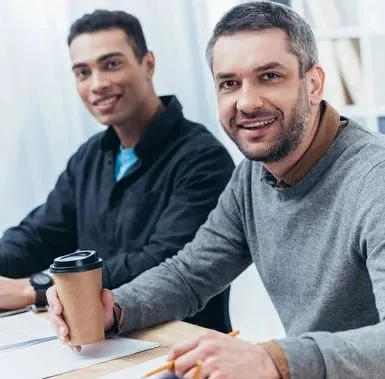 Two men sitting with coffee